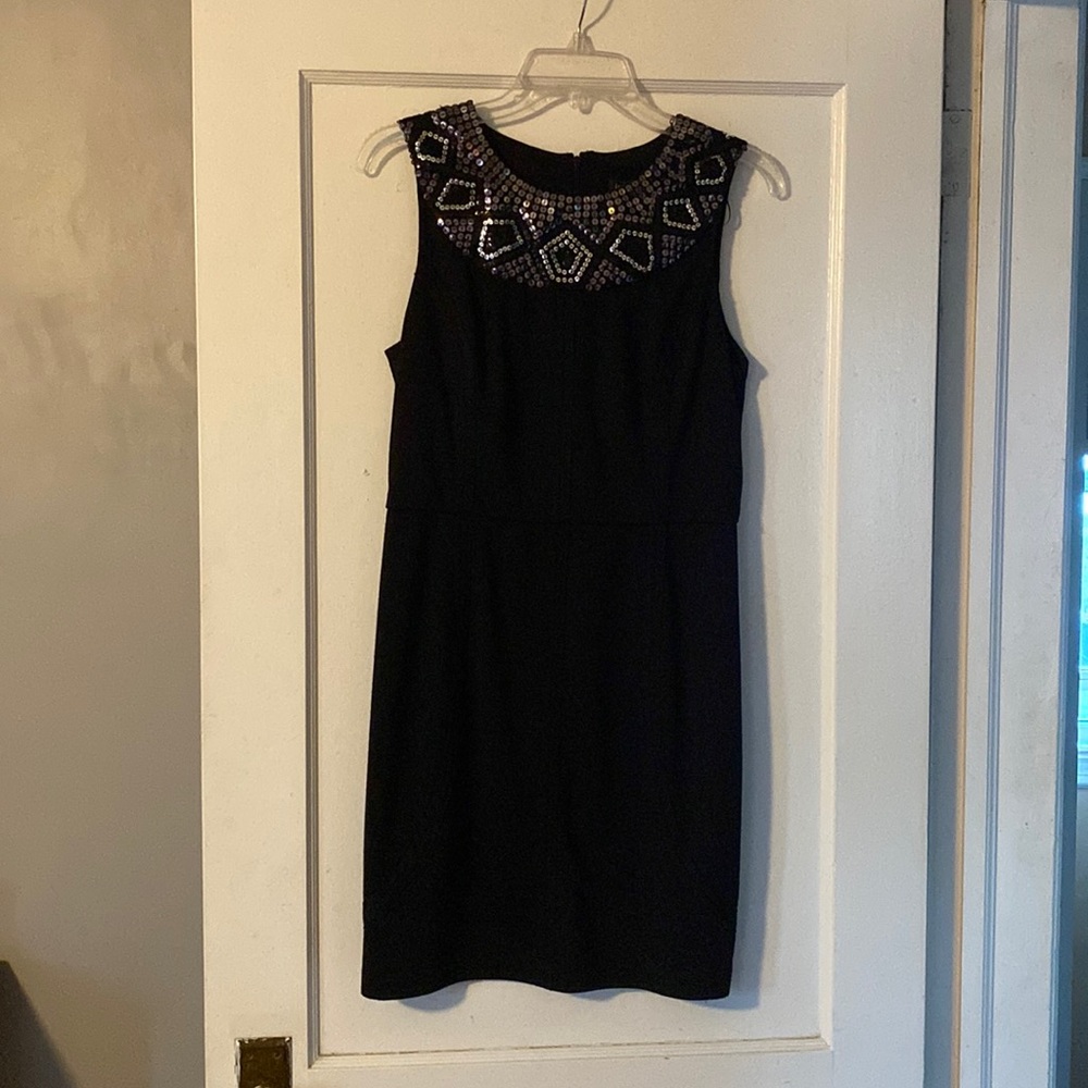 Black sleeveless knee length dress , with silver & black sequins.